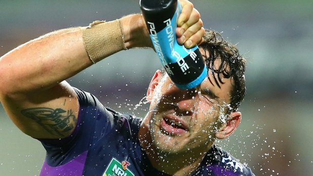 Cooling off: Billy Slater sprays himself with water during the round one NRL match between the Melbourne Storm and the St George Illawarra Dragons at AAMI Park.