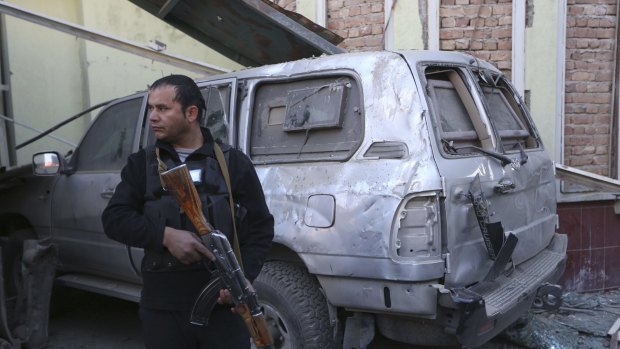 An Afghan security forces member stands guard at the Spanish Embassy after the Taliban attack in Kabul last week.