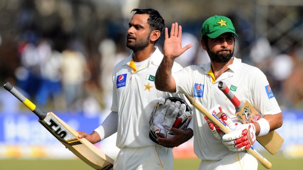Job well done: Pakistan's openers Ahmed Shehzad and Mohammad Hafeez leave the field after knocking off the 90 runs needed to defeat Sri Lanka.