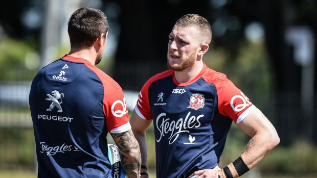 Master and pupil: Jackson Hastings talks to Mitchell Pearce talk during a Sydney Roosters training session. 