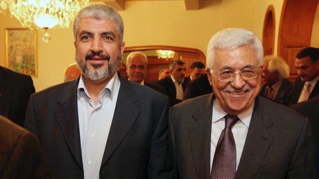 Hamas leader Khaled Mashaal, left, and Palestinian Authority president Mahmoud Abbas are seen together during a meeting in Cairo in 2011.