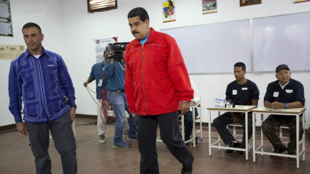 Venezuela's President Nicolas Maduro arrives at a polling station to vote on Sunday. 