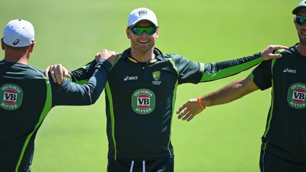 Australian captain Michael Clarke stretches with teammates during a training session in Perth on Tuesday.