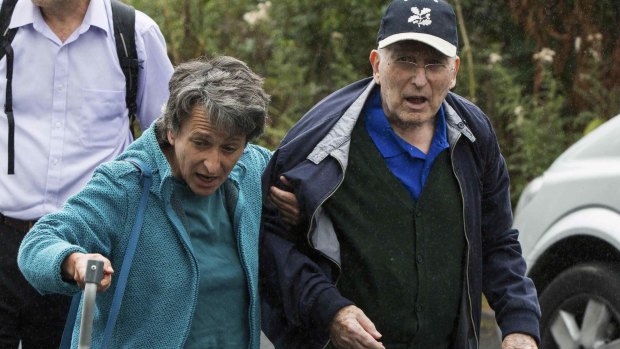 Lord Greville Janner arrives with his daughter Marion at a house after appearing at Westminster Magistrates' Court in London.