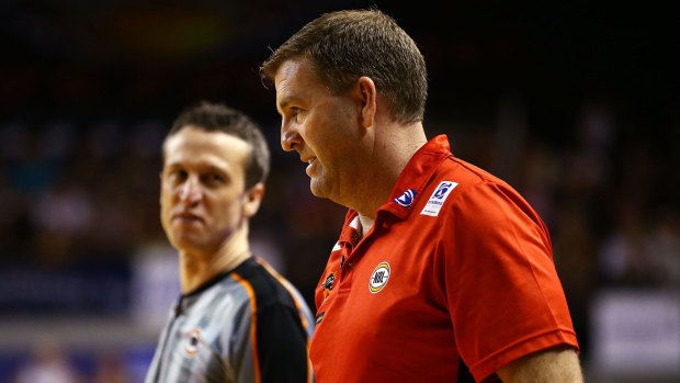 Far from happy: Wildcats coach Trevor Gleeson exchanges words with a referee during the NBL semi-final match between the Illawarra Hawks and the Perth Wildcats at Wollongong.