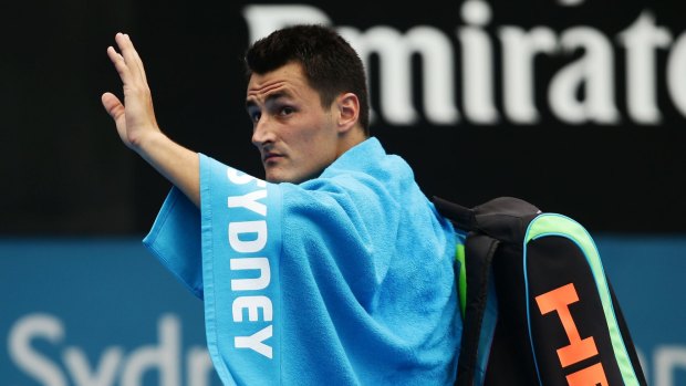 Farewell: Bernard Tomic waves to the crowd at Sydney Olympic Park Tennis Centre on Friday. 