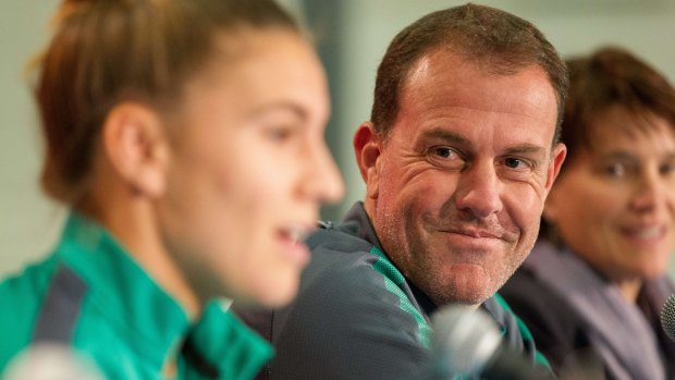 Australian coach Alen Stajcic (centre) listens as Steph Catley speaks during a press conference at the FIFA Women's World Cup in Edmonton.