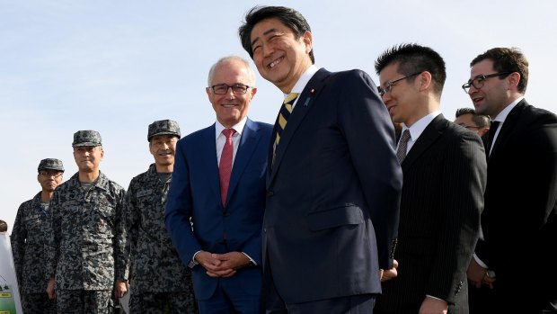Australian Prime Minister Malcolm Turnbull and Japanese Prime Minister Shinzo Abe inspect the Patriot Missile system and Australian made Bushmaster Protected Mobility vehicle at a Japan Ground Self Defence Force base at Narashino, Japan.