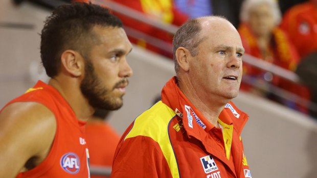 Before the break: Harley Bennell and Suns coach Rodney Eade.