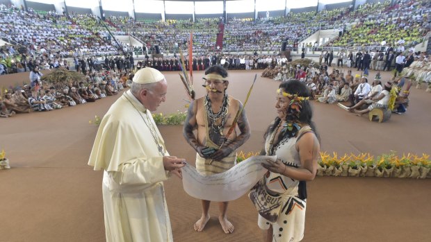 Thousands of indigenous people watch Pope Francis in Puerto Donaldo, Peru.