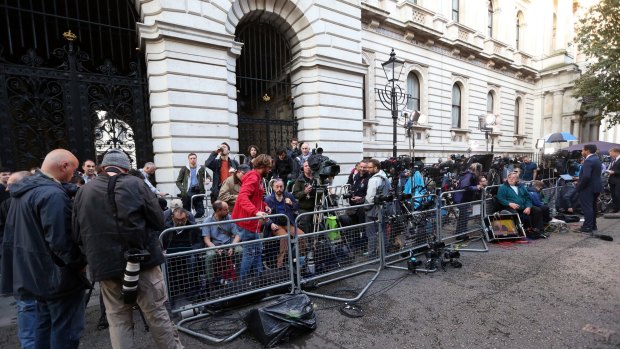 Media gather outside the home of British Prime Minister David Cameron at 10 Downing Street in London after the Brexit referendum.