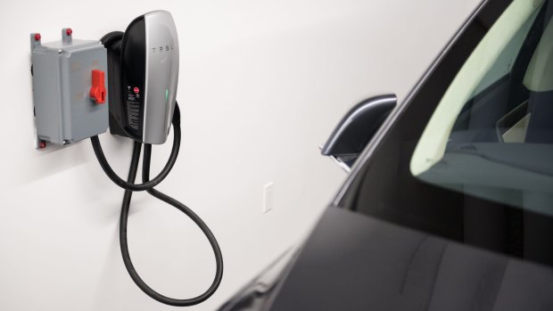A car charging station is seen at the new Tesla showroom in New York.