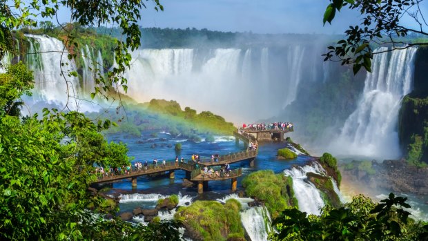 Tourists at Iguassu Falls, near the border of Argentina and Brazil. 