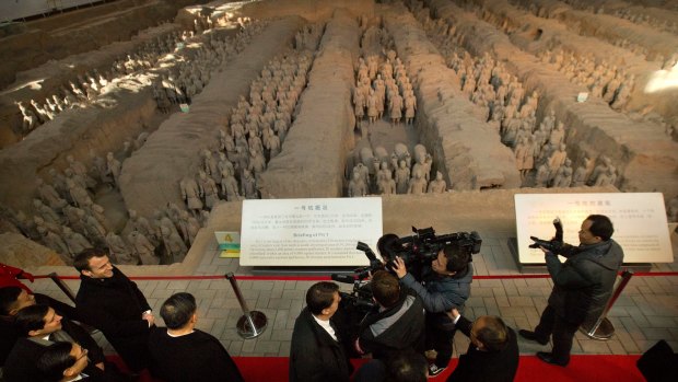 French President Emmanuel Macron, left, visits the Museum of Terracotta Warriors and Horses of Emperor Qin Shihuang in Xi'an in north-western China's Shaanxi Province.