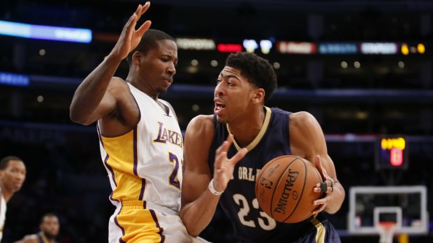 Force of nature: Anthony Davis takes it to the hoop for New Orleans against Lakers opponent Wayne Ellington.