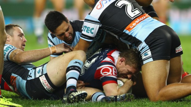Defensive lapse: Cronulla concede at try to Mitch Aubusson during the win over the Roosters.