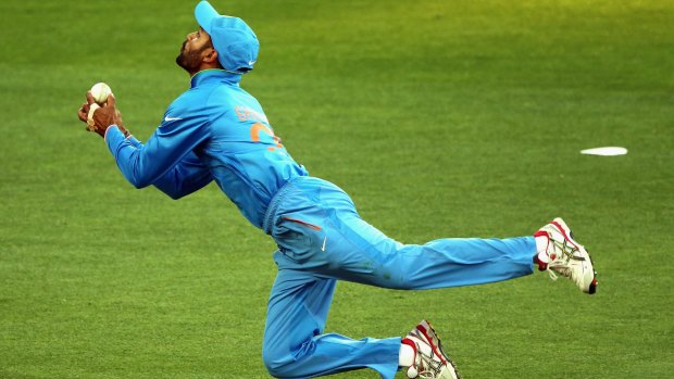 Shikhar Dhawan of India attempts to take a catch.