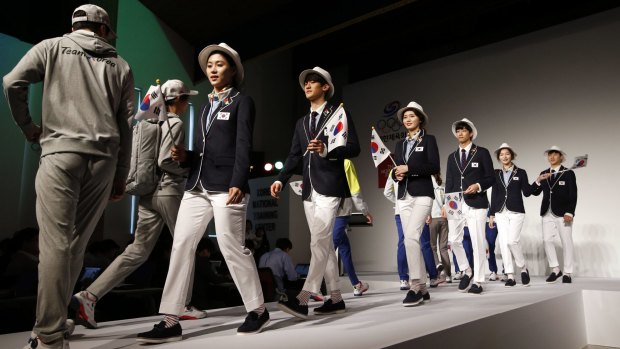 Protection: South Korean athletes model their 2016 Olympic uniform in Seoul.