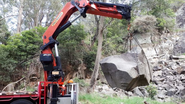 This rock specimen from Bowral's Mt Gibraltar starts its journey to the Canberra Rock Garden.