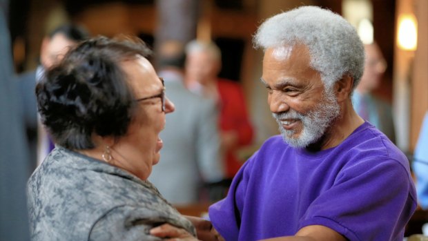 Nebraska state Senator Ernie Chambers celebrates with Senator Kathy Campbell after Nebraska's legislature voted to end the death penalty in the state.