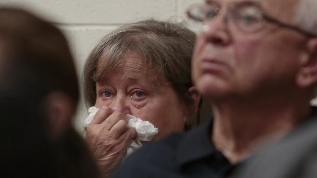 The grandmother of Conrad Roy III weeps as she listens to the defence attorney arguing for the involuntary manslaughter charge to be dismissed.