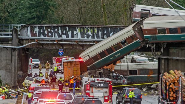 Cars from an Amtrak train that derailed lie spilled onto Interstate 5, in DuPont, Washington, last month.