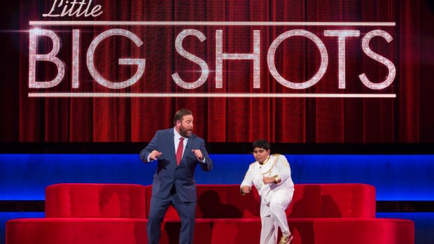 Host Shane Jacobson and guest in Little Big Shots.