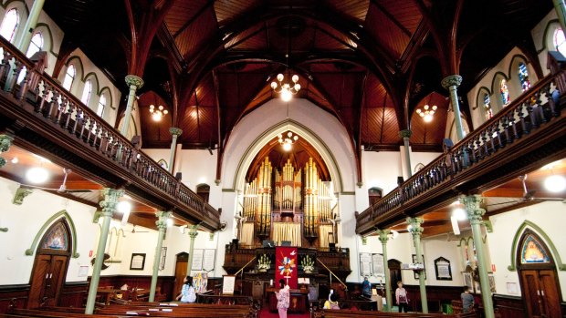 The deep cedar timbers and vaulted timber ceilings attracting international tourists to the Albert Street Uniting Church.
