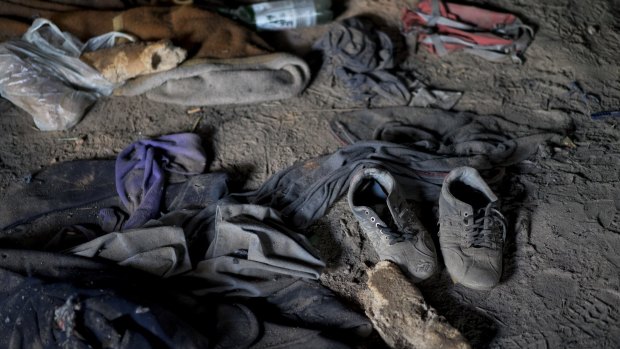 Discarded clothes, shoes and bread at an abandoned brick factory in Subotica, Serbia.