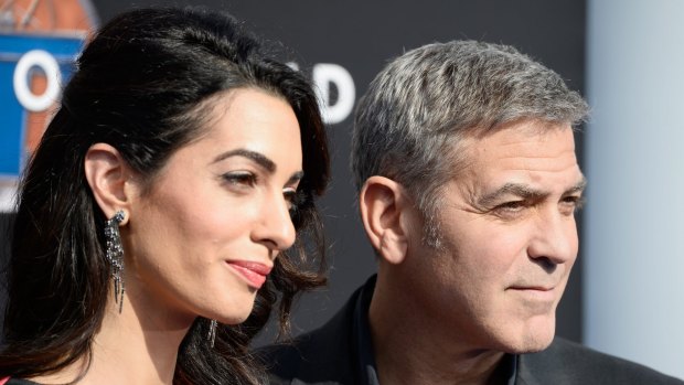 Amal Clooney (left) and her husband, George Clooney, at a premiere this weekend.