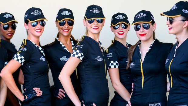 Grid Girls pose prior to the qualifying session at the Yas Marina Circuit in Abu Dhabi, United Arab Emirates, 02 November 2013.