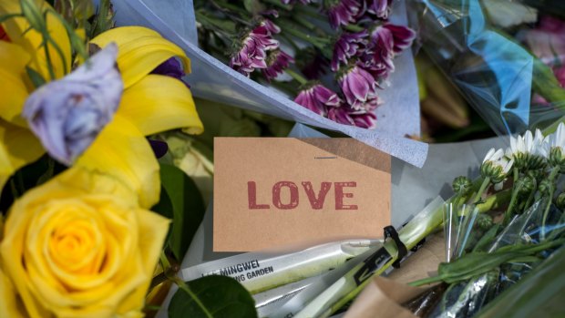 Tributes left outside the RACV club in Bourke Street for victims of the rampage.