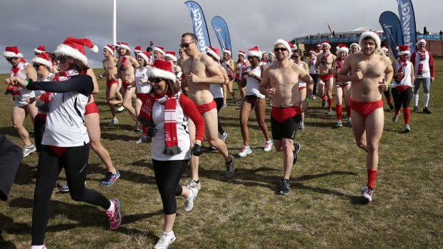 Runners in last year's 6500 Santa Speedo Shuffle around Lake Burley Griffin.
