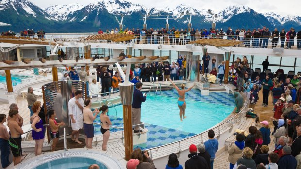 Ocean cruises tend to offer a  more high-octane atmosphere: A passenger jumps into a freezing cold swimming pool while fellow travellers remain bundled up in coats.
