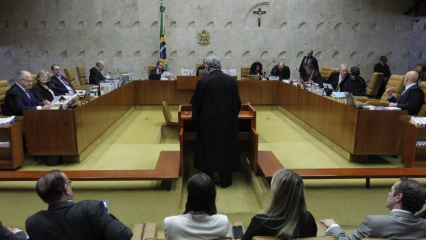 Lawyer Antonio Claudio Mariz, standing centre, presents the defence of Brazilian President Michel Temer, in the Supreme Court in Brasilia.