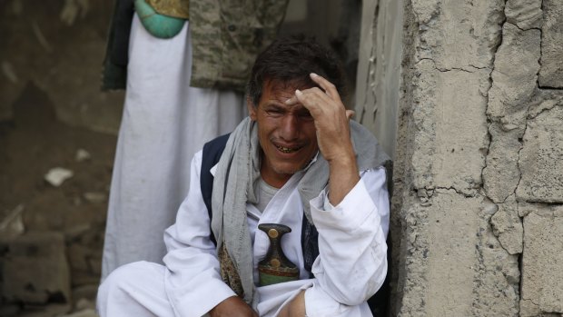 A man cries after some of his relatives were killed in a Saudi-led airstrike in Sanaa, Yemen on Monday.