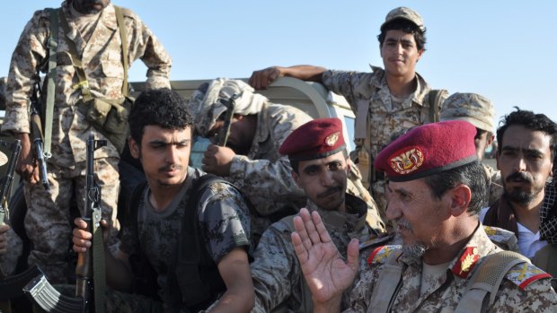 Yemeni General Abd al-Rab Qassim al-Shadadi, right, speaks to his troops at a United Arab Emirates military base near Saffer, Yemen.