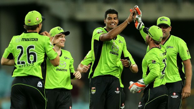Gurinder Sandhu celebrates with teammates after taking a wicket against Brisbane Heat last week.