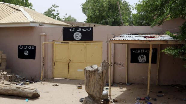A deserted compound held by Boko Haram in Damasak. The flag of the so-called Islamic State is painted on the walls.