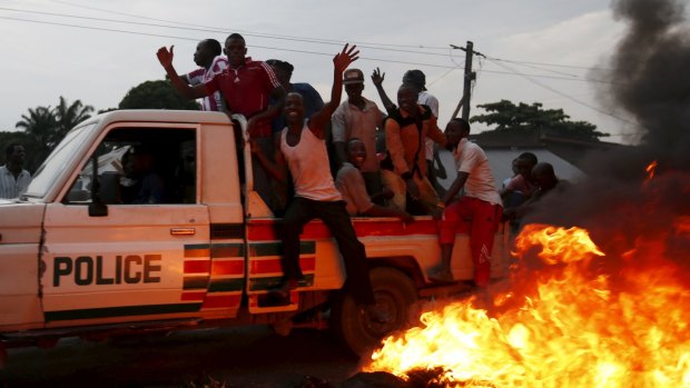 Protesters on a police vehicle at the protest against Burundi President Pierre Nkurunziza and his bid for a third term.