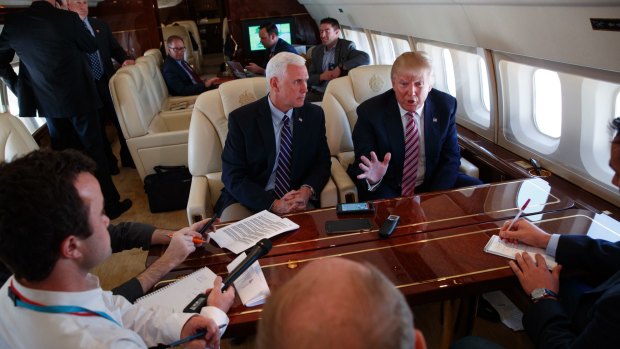 Donald Trump on board his campaign plane, with Mike Pence. 