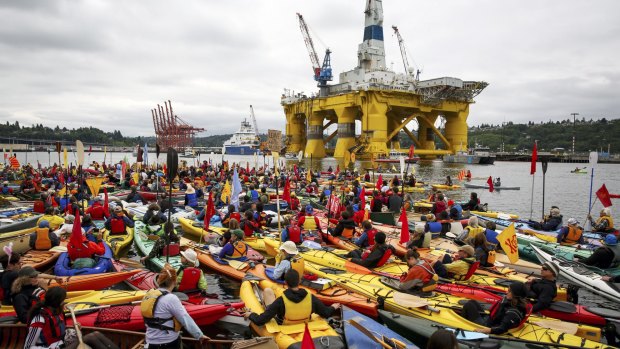 Activists who oppose Royal Dutch Shell's plans to drill for oil in the Arctic Ocean prepare their kayaks for the "Paddle in Seattle" protest in Seattle on Saturday. 