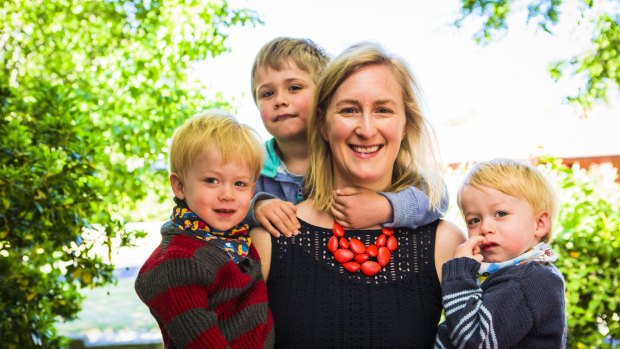 Julia Ellyard  holds  her 2-year-old twin boys Leo Turner (left), and Max Turner (right), with her eldest  Alex Turner, 5.