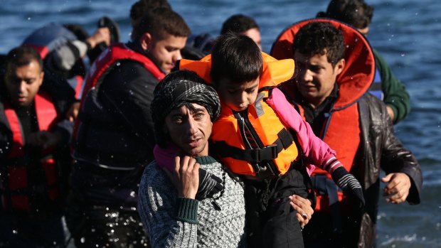 Refugees arrive at the Greek island of Lesbos on Thursday after making the ocean crossing from Turkey. 