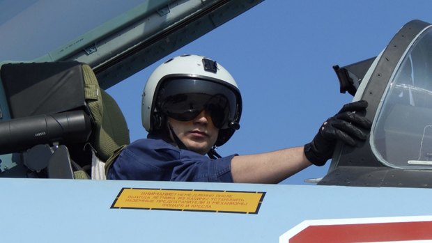 A Russian pilot prepares for take off at Hemeimeem air base in Syria on Tuesday.