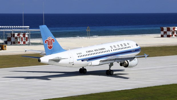 A China Southern Airlines jetliner lands in January at the airfield on Fiery Cross Reef in the Spratly Islands of the South China Sea. 