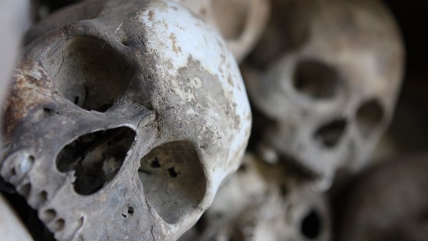 Human remains are still visible in the real Killing Fields of the village Choeung, Cambodia, where 17,000 people died. 
