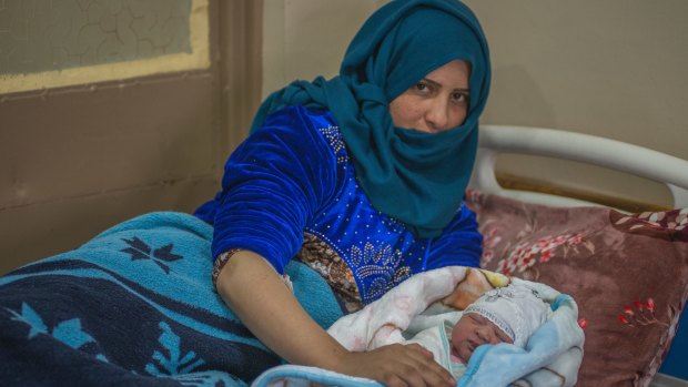 New life brings hope: Susanne, a young Iraqi mother with her newborn baby at West Mosul General Hospital. 