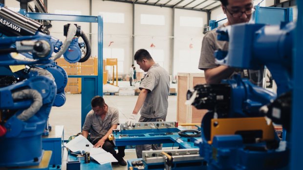 Workers assembling robots at a factory in Shenyang. Beijing hopes to dominate cutting-edge technologies like artificial intelligence.