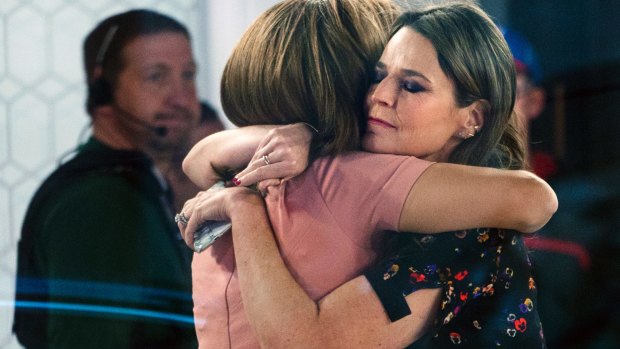 Co-anchors Hoda Kotb and Savannah Guthrie embrace on the set of the "Today" show after announcing Lauer's departure to viewers. 